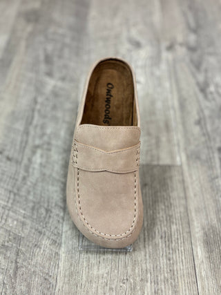 A single taupe slip on mule shoe