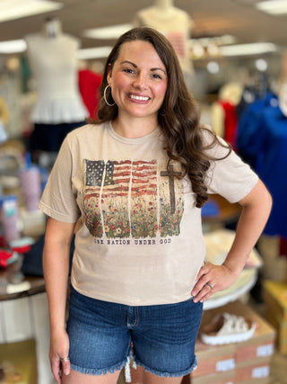 Woman wearing a t-shirt with an American flag design in a store setting