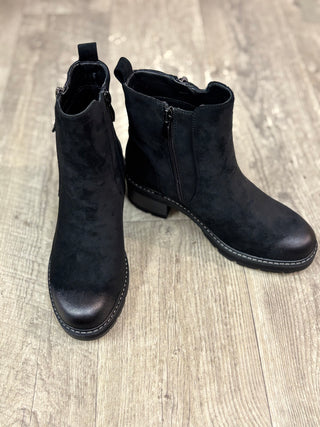 A pair of black suede ankle boots with double zipper detail