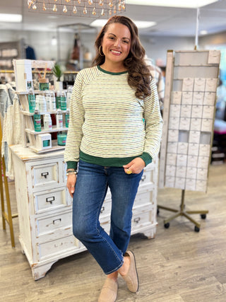 Close-up of hunter green trim on the Evergreen Stripes long sleeve top