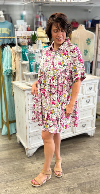 Model wearing pink and white floral dress