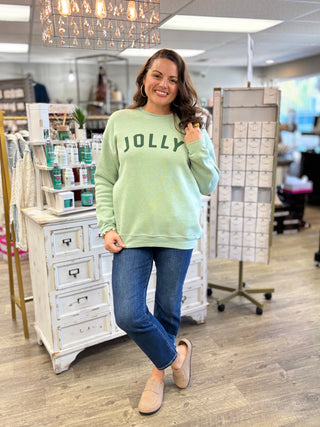 Close-up of the Jolly graphic on the dark heather sage sweatshirt