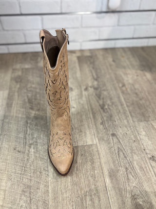 A taupe colored boot with unique stitching and zipper detail
