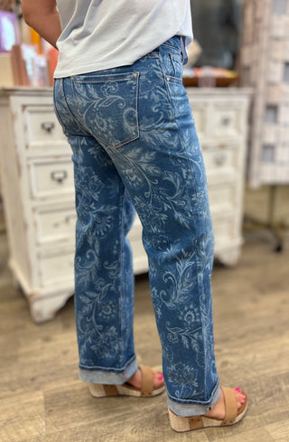 Model wearing paisley printed cuffed jeans