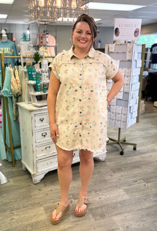 Woman wearing a floral dress in a store setting