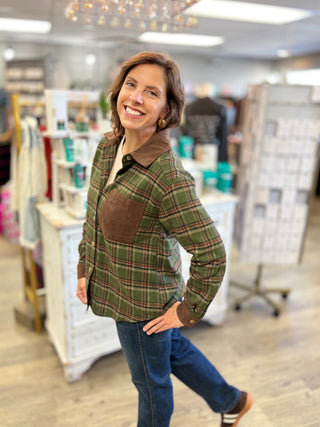 Side view of the Cabin Fever olive and brown plaid flannel shirt showing its slightly relaxed fit and long sleeves with corduroy cuffs