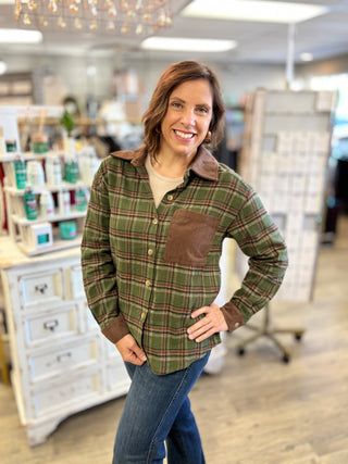 Front view of the Cabin Fever olive plaid flannel shirt showing the chocolate corduroy collar, corduroy chest pocket, button front and corduroy sleeve cuffs