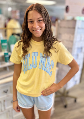 Model wearing butter yellow LULU MAC t-shirt with baby blue detail