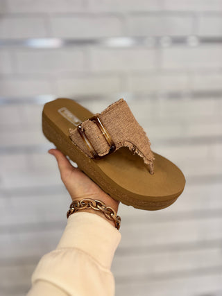 Brown platform flip flop with buckle detail