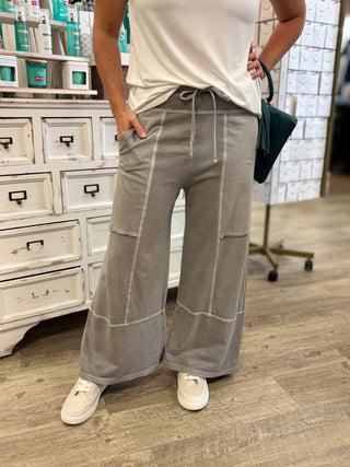 Model wearing sleet grey colored lightweight lounge pants with drawstring 
