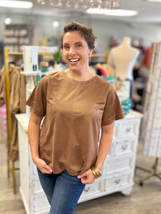 Close-up of the Salted Caramel Suede Top front showing the soft camel faux suede texture, round neckline, short sleeves and contrast stitching