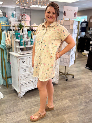 Woman wearing a floral dress in a store setting