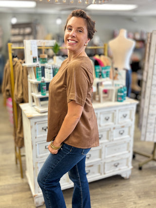 Side view of the camel Salted Caramel Suede Top showing its relaxed, flowy swing fit and short sleeves