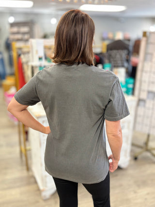 Back view of model wearing black mineral washed tee shirt