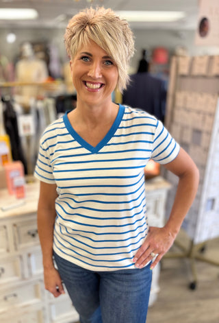Woman wearing a striped shirt in an indoor setting